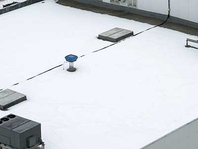 Top view of a typical white commercial flat roof