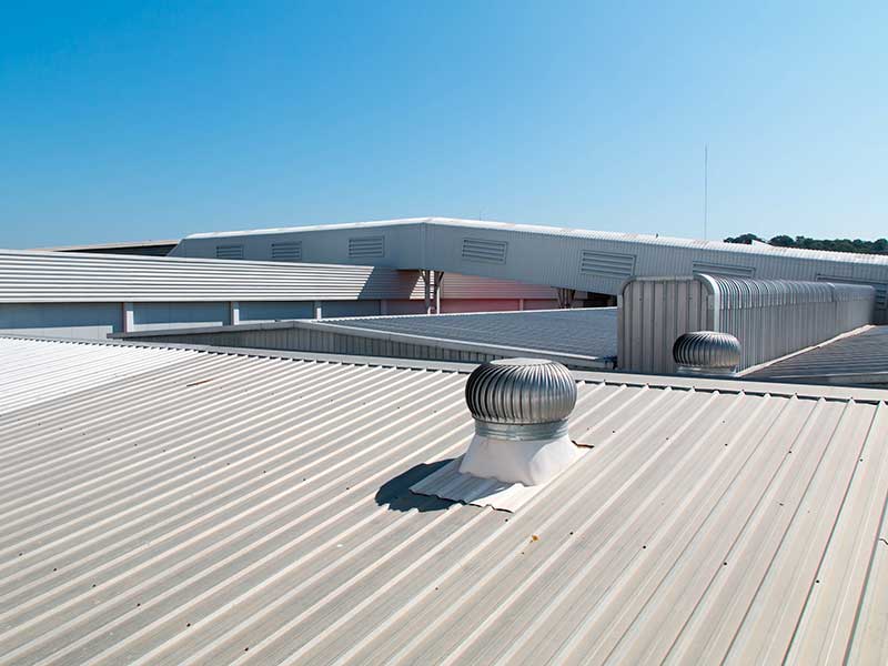 Close up of a gray metal roof on a large commercial building